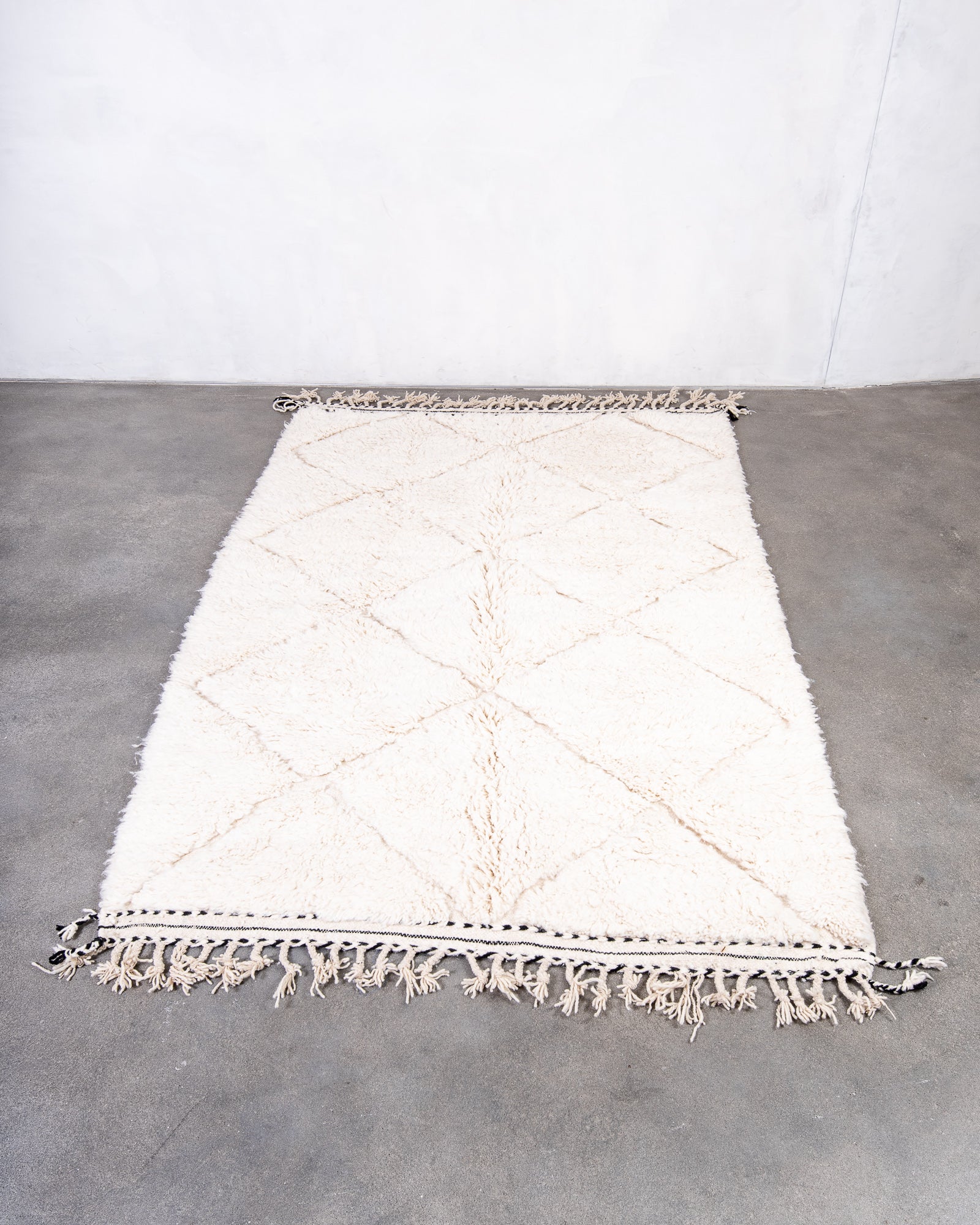 Modern, designer, handcrafted Berber rug from Morocco. Beniourain carpet with beautiful colours and patterns and fluffy wool texture.